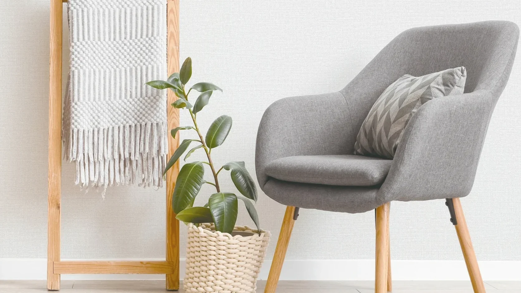 Scandinavian reading corner featuring MIRA 42-inch Misty Grey Nordic Basketweave Linen wallcovering (NQH796302) and sculptural grey armchair.