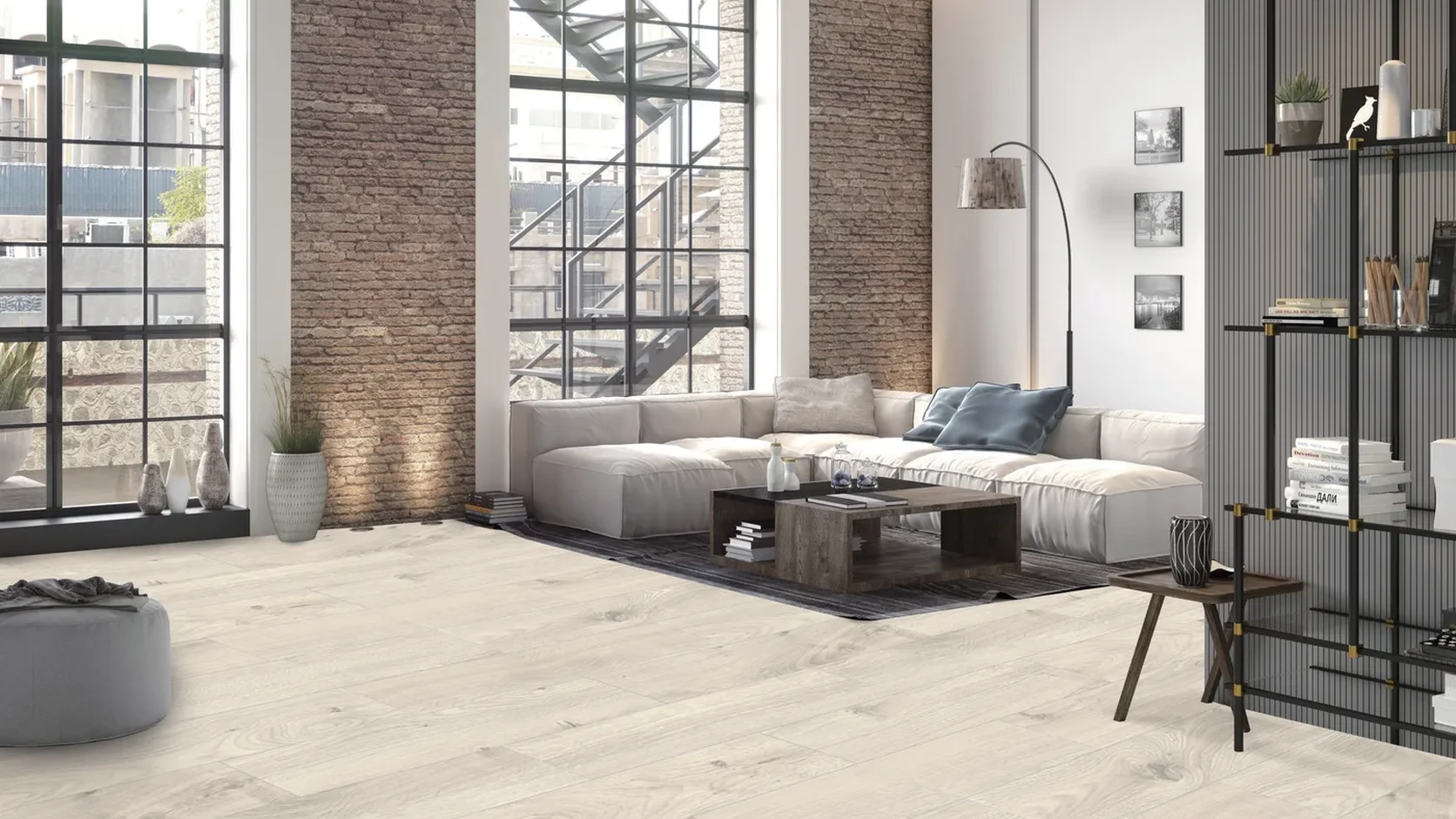 Sunlit open-plan loft living room featuring Dynamic SPC Nordic Whitewashed Oak rigid-core flooring (DSPC-6002) and full-height industrial windows.
